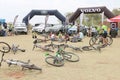 Abandoned Bicycles in front of luxury 4x4 motor car display at B